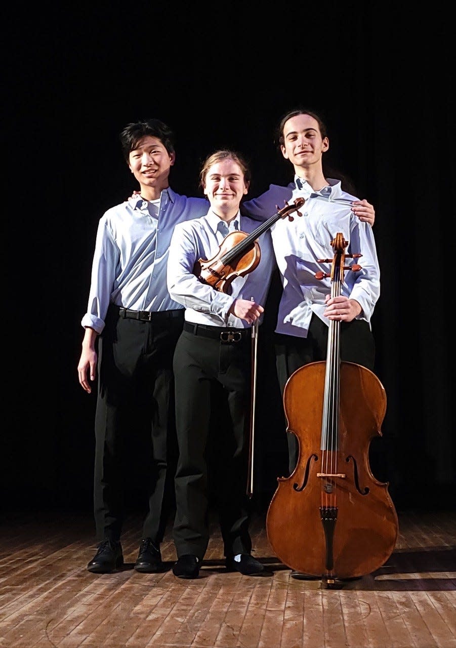 Lily Sullivan, Noah Kim, and Serge Kalinovsky are recognized as the Goya Piano Trio. They recently won first place at the Rembrandt Chamber Musicians annual competition.