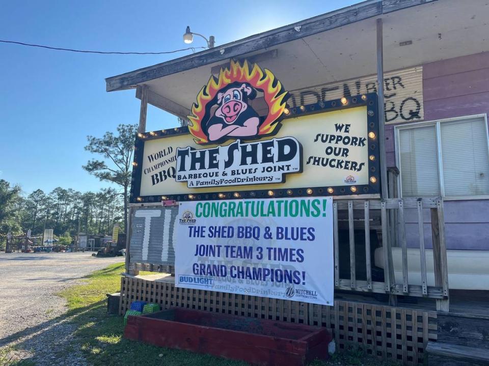 A sign congratulating The Shed’s grand champion team can be seen at the restaurant’s entrance.