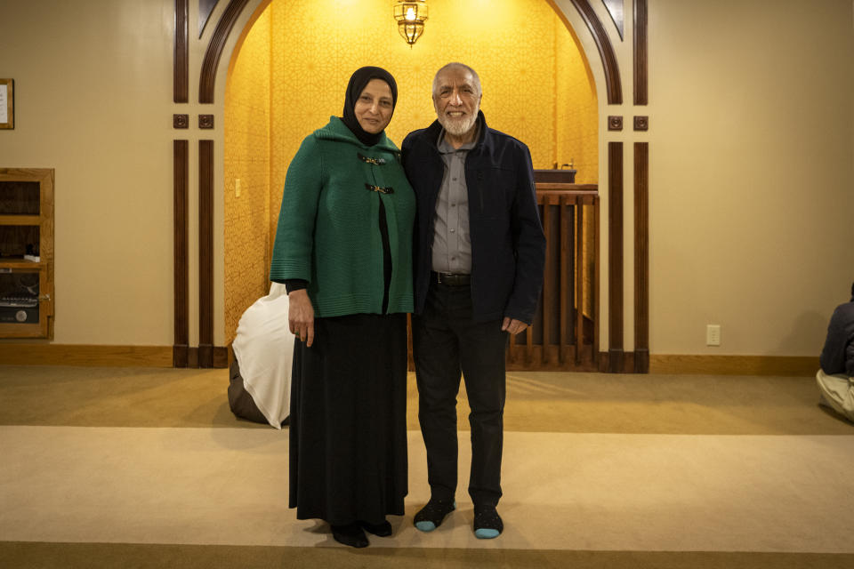 Bibi Bahrami stands for a portrait with her husband, Dr. Mohammad Saber Bahrami, at the Islamic Center of Muncie, Ind., on Friday, March 3, 2023, where she is one of the mosque's leaders. Bahrami is a subject of the documentary "Stranger at the Gate" that tells the story of the relationship she and others in their small Islamic community fostered with Richard McKinney, a former U.S. Marine who at one point had planned to bomb their community center. (AP Photo/Doug McSchooler)