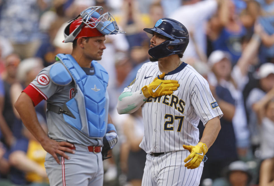 Milwaukee Brewers' Willy Adames reacts after his three-run home run against the Cincinnati Reds during the sixth inning of a baseball game, Sunday, June 16, 2024, in Milwaukee. (AP Photo/Jeffrey Phelps)