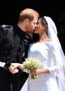 <p>Officially the Duke and Duchess of Sussex, the newlyweds share a kiss outside the church. </p>