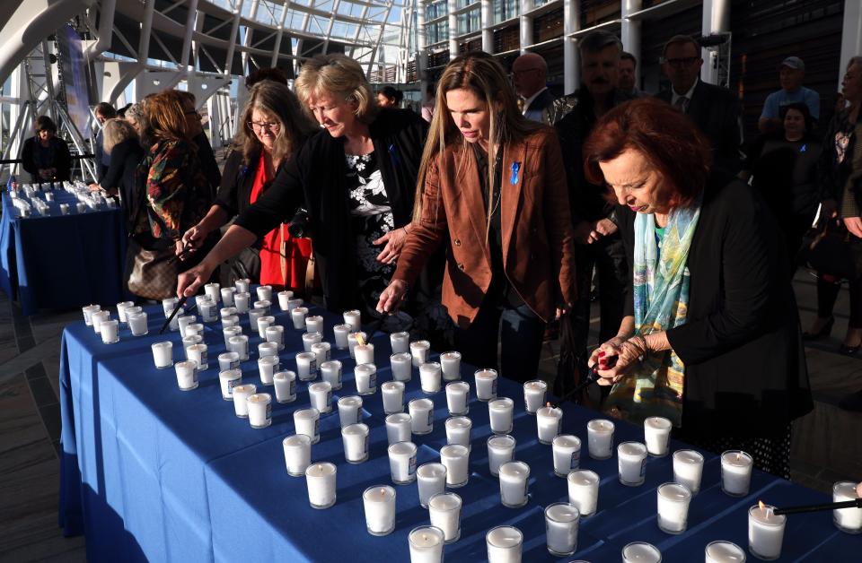 People light memorial candles on Oct. 17 during "A Night to Stand With Israel" at the First Americans Museum in Oklahoma City.
