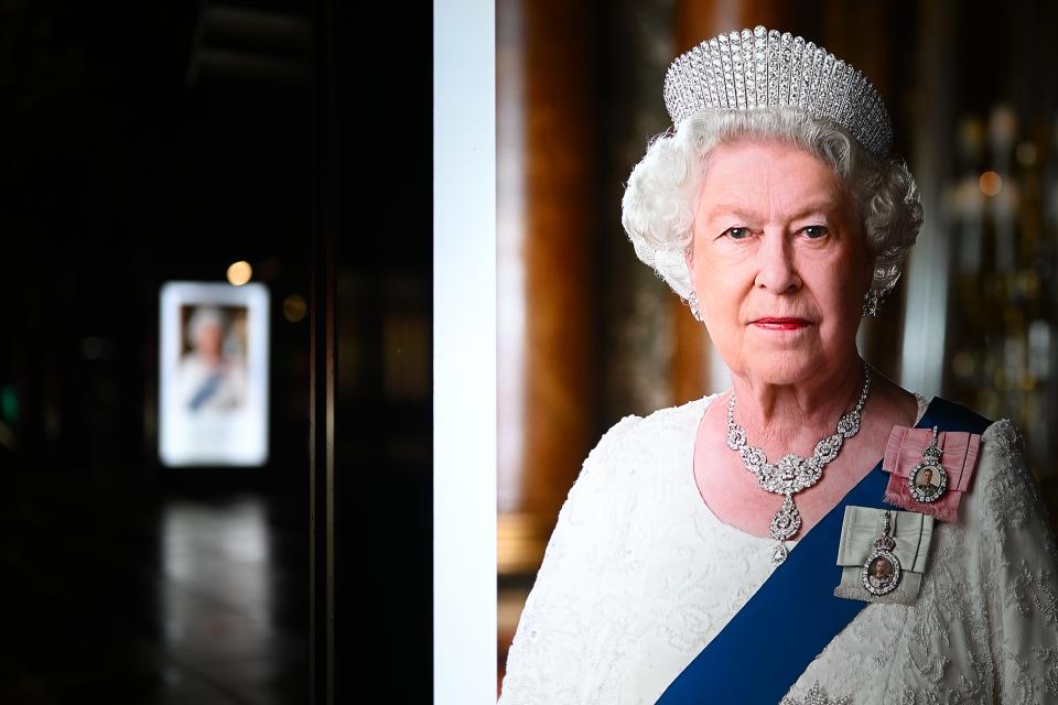 Digital advertising boards at bus stops in London are adorned with images of Queen Elizabeth II after her death.