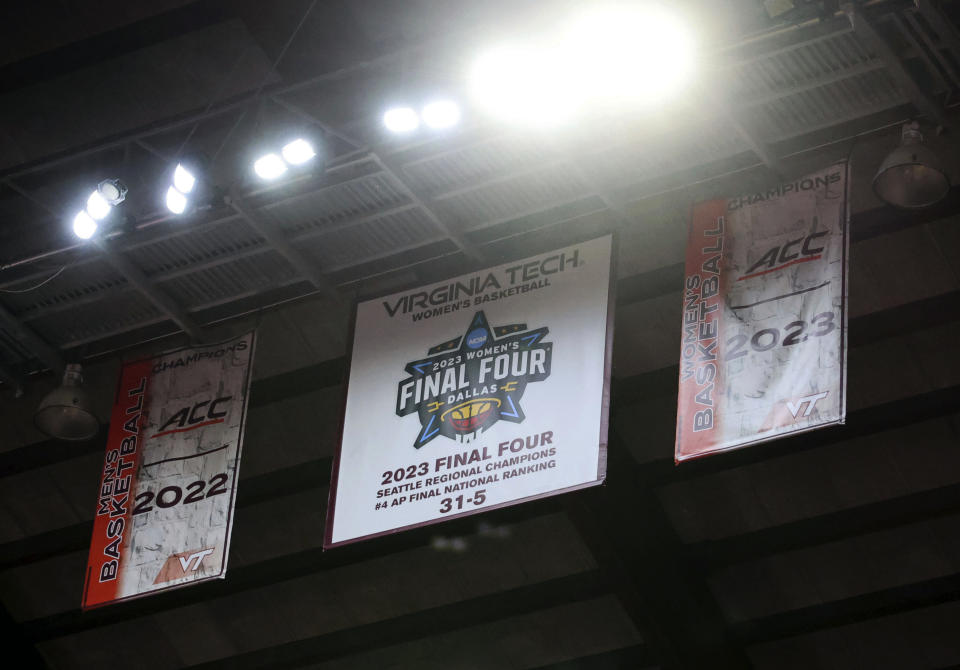 A Virginia Tech Final Four appearance banner is spotlit prior to an NCAA college basketball game against High Point in Blacksburg, Va., Monday, Nov. 6, 2023. (Matt Gentry/The Roanoke Times via AP)