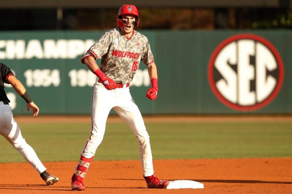 NC State’s Alex Sosa (16) celebrates after making it safe to second base during Game 3 of the Super NCAA regional at Foley Field on Monday, June 10, 2024 in Athens, Ga.