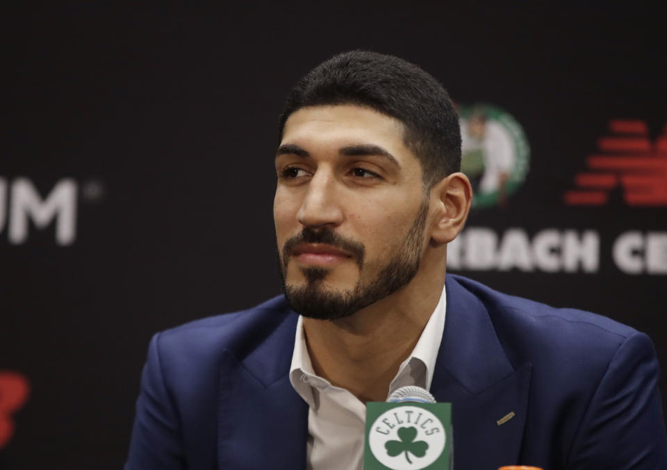 Newly acquired Boston Celtics center Enes Kanter listens during a news conference at the Celtics' basketball practice facility, Wednesday, July 17, 2019, in Boston. (AP Photo/Elise Amendola)