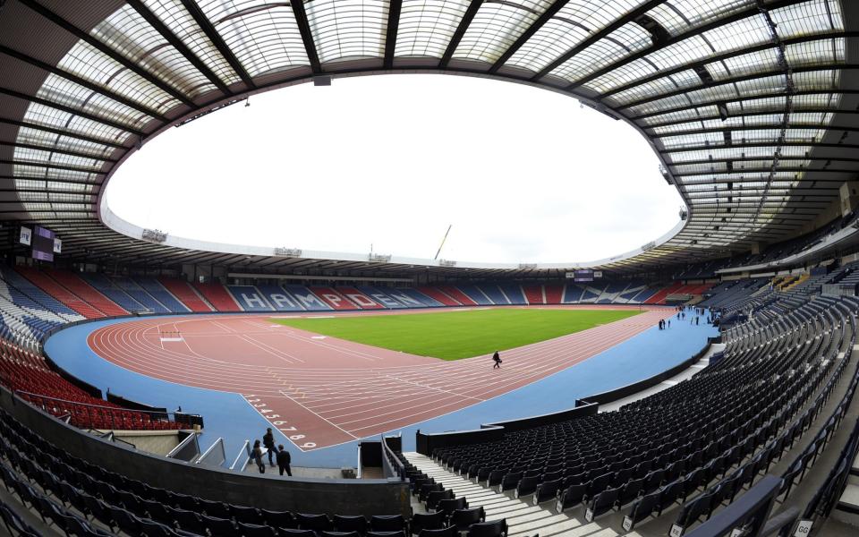 Hampden Park in Glasgow where fans only need wear a mask to attend - AFP