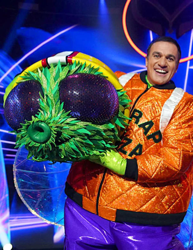 Shannon Noll holds the head of his blowfly costume. 