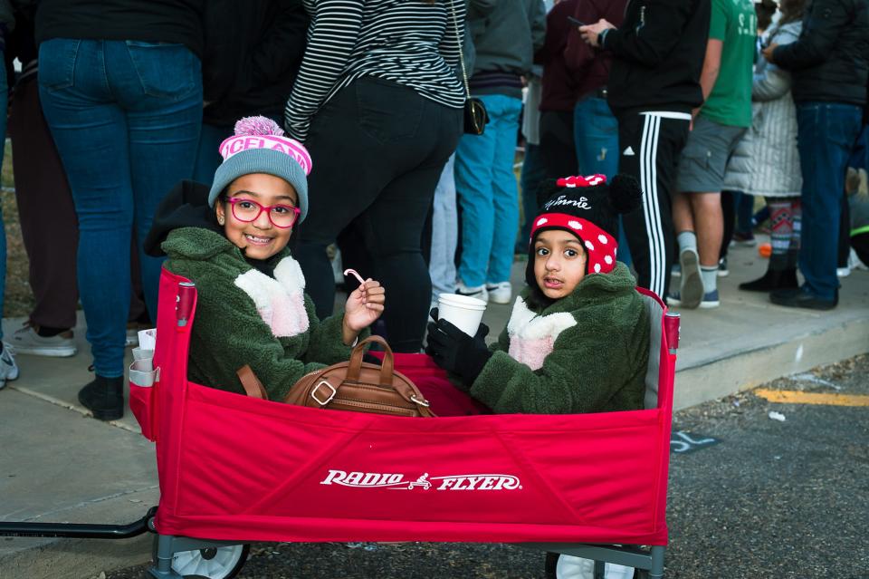 Suri and Mila Bhakta stay warm with some hot cocoa and candy canes prior to the city of Canyon's Parade of Lights on Saturday evening. For more photos from Saturday's event, see amarillo.com