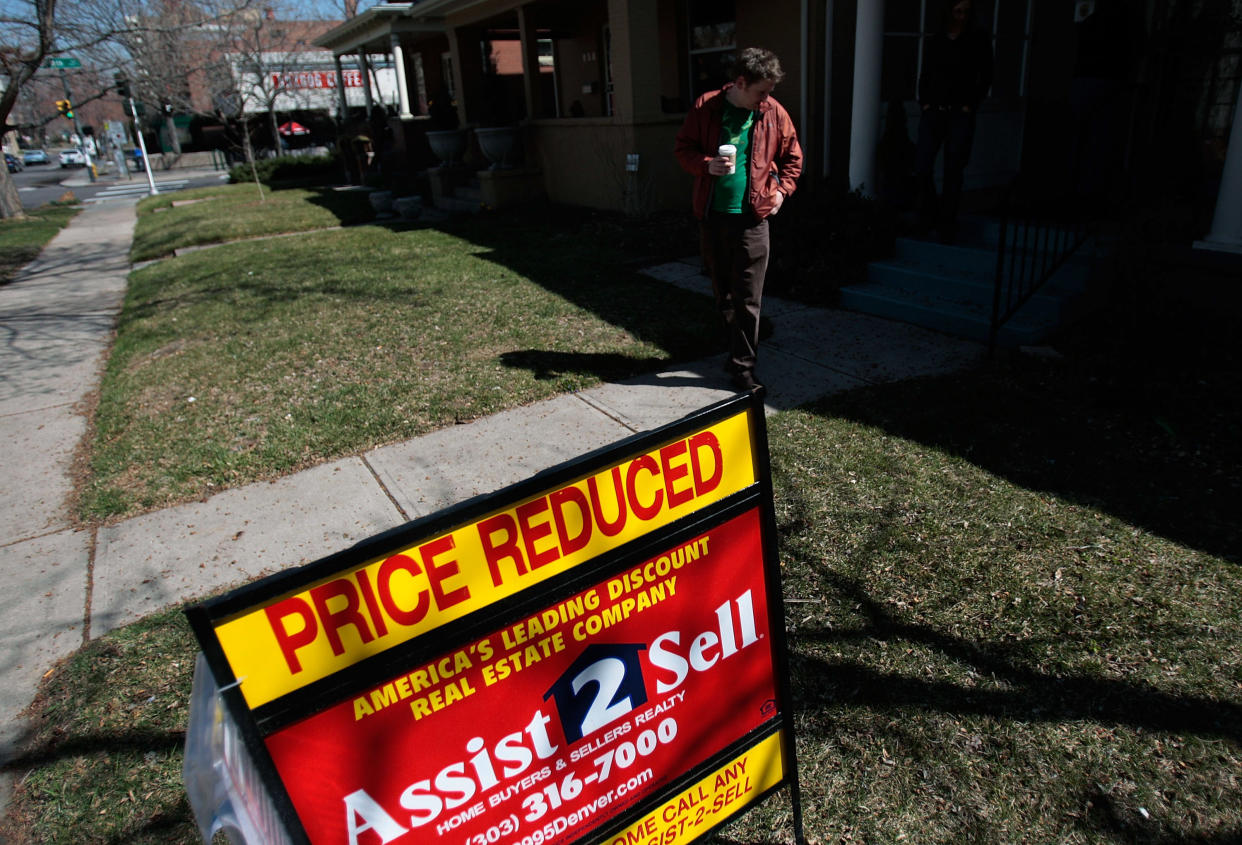 Prospective home buyer  Lars Kalnajs looks over a home that has been reduced in price in Denver, Colorado.  (Credit: Chris Hondros, Getty Images)