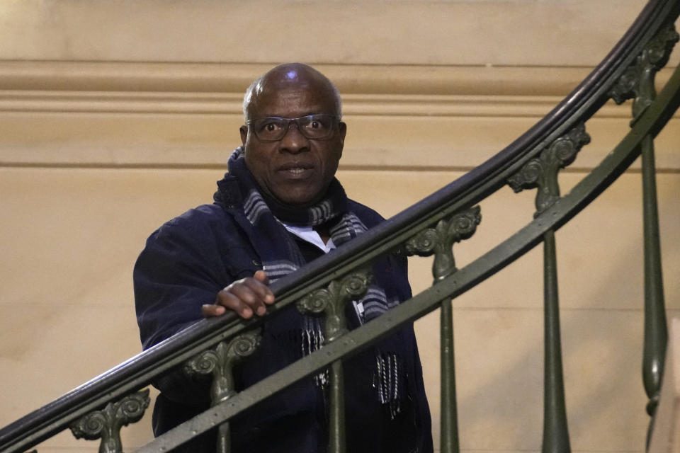 Sosthene Munyemana, a Rwandan doctor arrives at Paris court house, Thursday, Nov. 23, 2023 over his alleged role in the 1994 genocide in his home country. Munyemana who has been living in France for decades faces charges of genocide, crimes against humanity and complicity in such crimes. (AP Photo/Christophe Ena)