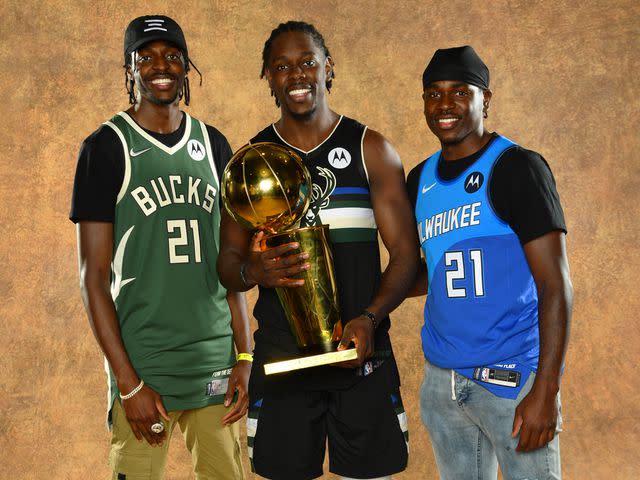 Jesse D. Garrabrant/NBAE/Getty Justin Holiday #8 of the Indiana Pacers, Jrue Holiday #21 of the Milwaukee Bucks, and Aaron Holiday #3 of the Indiana Pacers pose for a portrait with the Larry O'Brien Trophy after winning Game Six of the 2021 NBA Finals.