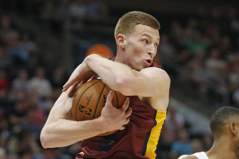 FILE - In this July 2, 2019, file photo, Cleveland Cavaliers forward Dylan Windler pulls down a rebound during the first half of an NBA Summer League basketball game against the Utah Jazz in Salt Lake City. Windler broke his left hand in the season opener, another medical setback for a promising player. The team said Thursday, Dec. 24, 2020, that Windler suffered a fourth metacarpal fracture when he took a hard fall in the third quarter against Charlotte. X-rays after the game were negative, but further tests revealed the fracture. (AP Photo/Rick Bowmer, File)