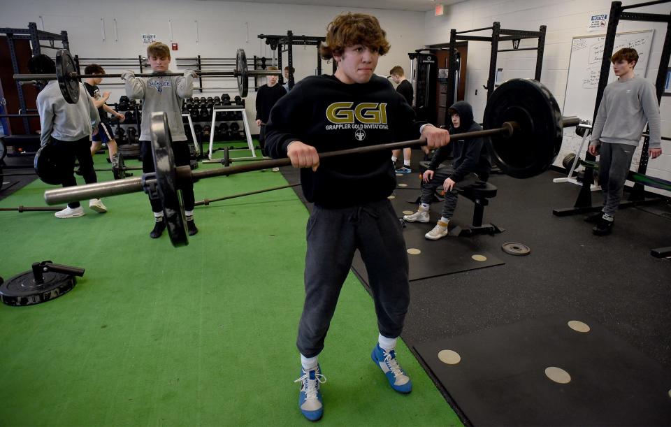 Blake Cosby (144) (foreground) and Kole Katschor (157) behind and the rest of the Vikings going to the state meet run through clean and jerk repetitions. The Vikings are preparing for the Individual State Wrestling Finals at Ford Field in Detroit Friday and Saturday.