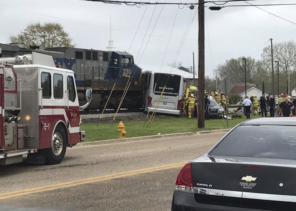 Train hits bus, killing 4