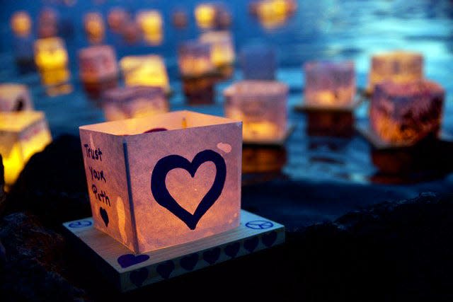 Glowing and colorful lanterns are set adrift at the Water Lantern Festival in Buffalo, N.Y.