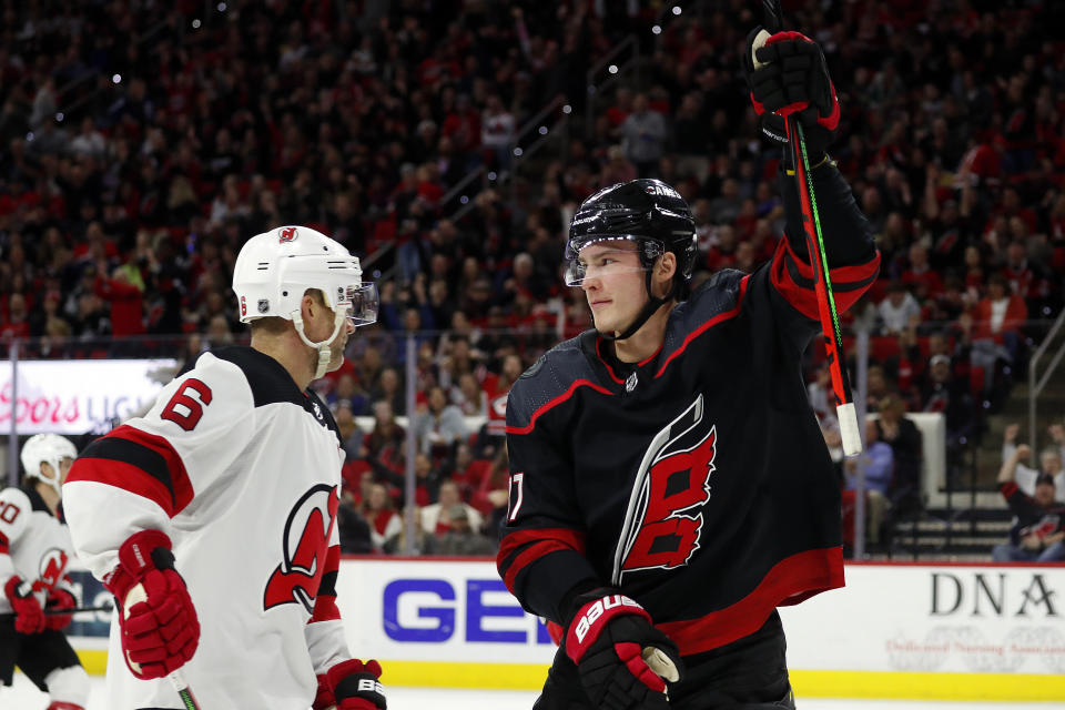 Carolina Hurricanes' Andrei Svechnikov (37), of Russia, celebrates his goal as he skates by New Jersey Devils' Andy Greene (6) during the second period of an NHL hockey game in Raleigh, N.C., Friday, Feb. 14, 2020. (AP Photo/Karl B DeBlaker)