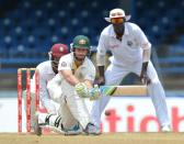 Australian batsman Matthew Wade plays a shot during the final day of the second-of-three Test matches between Australia and West Indies April19, 2012 at Queen's Park Oval in Port of Spain, Trinidad.