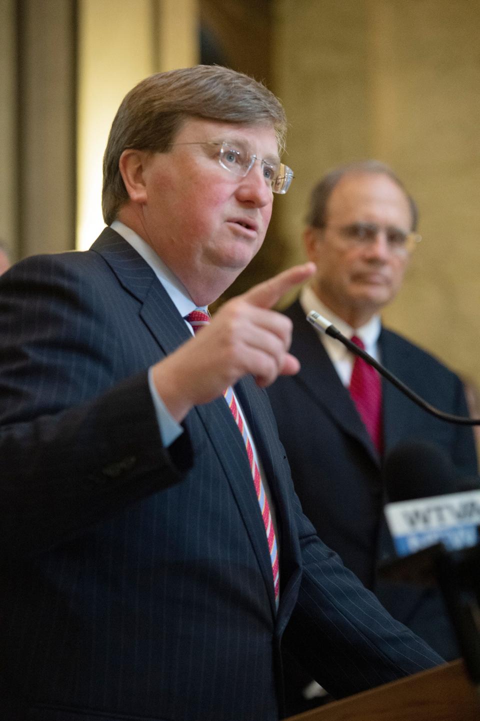 Lt. Gov. Delbert Hosemann listens, background, Gov. Tate Reeves states that, “Mississippi is open for business,” after the Legislature passed bills that include incentives for a major economic development project in the Golden Triangle during a Legislative Special Session in Jackson, Miss., Wednesday, Nov. 2, 2022. 