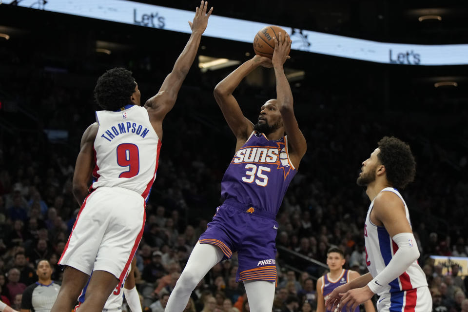 Phoenix Suns forward Kevin Durant shoots over Detroit Pistons forward Ausar Thompson (9) during the second half of an NBA basketball game, Wednesday, Feb. 14, 2024, in Phoenix. (AP Photo/Rick Scuteri)
