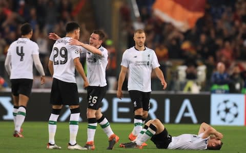 AS Roma versus Liverpool; James Milner of Liverpool falls to the floor in celebrations as Liverpool qualify for UEFA Champions League final - Credit: Getty Images