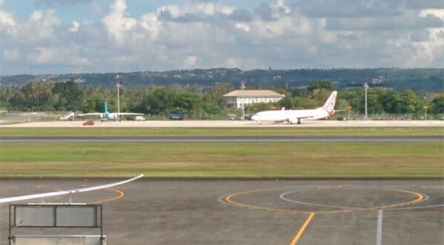 Indonesia's army has confirmed the plane is at the end of the runway at Bali's Ngurah Rai airport. Photo: Chris Corless/Twitter.