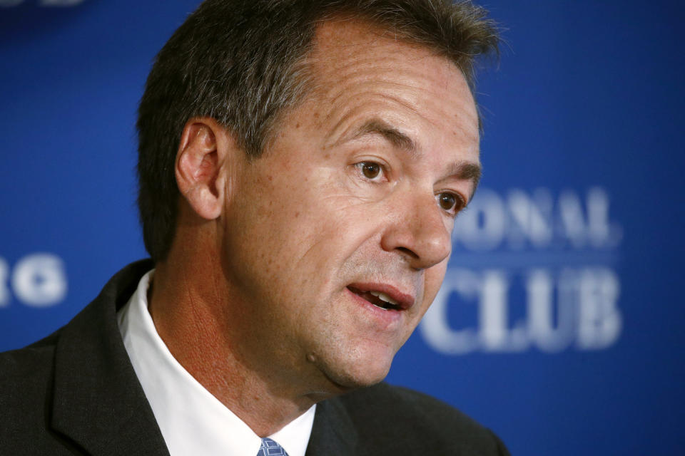 FILE - In this Aug. 7, 2019 file photo, Democratic Montana Gov. Steve Bullock speaks at the National Press Club in Washington. Bullock was the lame-duck governor of solidly red Montana, fresh off a failed Democratic presidential bid, when he pivoted and announced he’d challenge Republican Sen. Steve Daines for his seat. But days after he announced his candidacy last month, the coronavirus claimed its first cases in Montana. That shifted the spotlight onto Bullock as he leads the state’s pandemic response, leaving Daines in the unusual position of a sitting senator competing for attention. (AP Photo/Patrick Semansky, File)