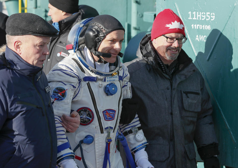 CSA astronaut David Saint Jacques, crew members of the mission to the International Space Station, ISS, walks to the rocket prior to the launch of Soyuz-FG rocket at the Russian leased Baikonur cosmodrome, Kazakhstan, Monday, Dec. 3, 2018. (AP Photo/Shamil Zhumatov, Pool)