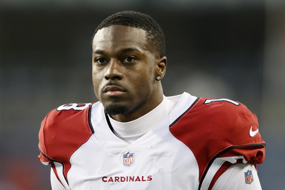 Helmetless A.J. Green in a white Cardinals uniform