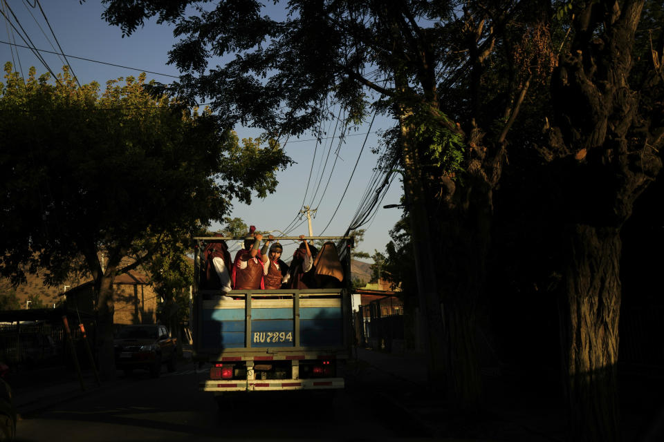 Devotees dressed as Roman soldiers are transported in a cargo truck before the start of a Way of the Cross reenactment, as part of Holy Week celebrations, in Colina, Chile, Friday, March 29, 2024. Holy Week commemorates the last week of Jesus' earthly life which culminates with his crucifixion on Good Friday and his resurrection on Easter Sunday. (AP Photo/Esteban Felix)