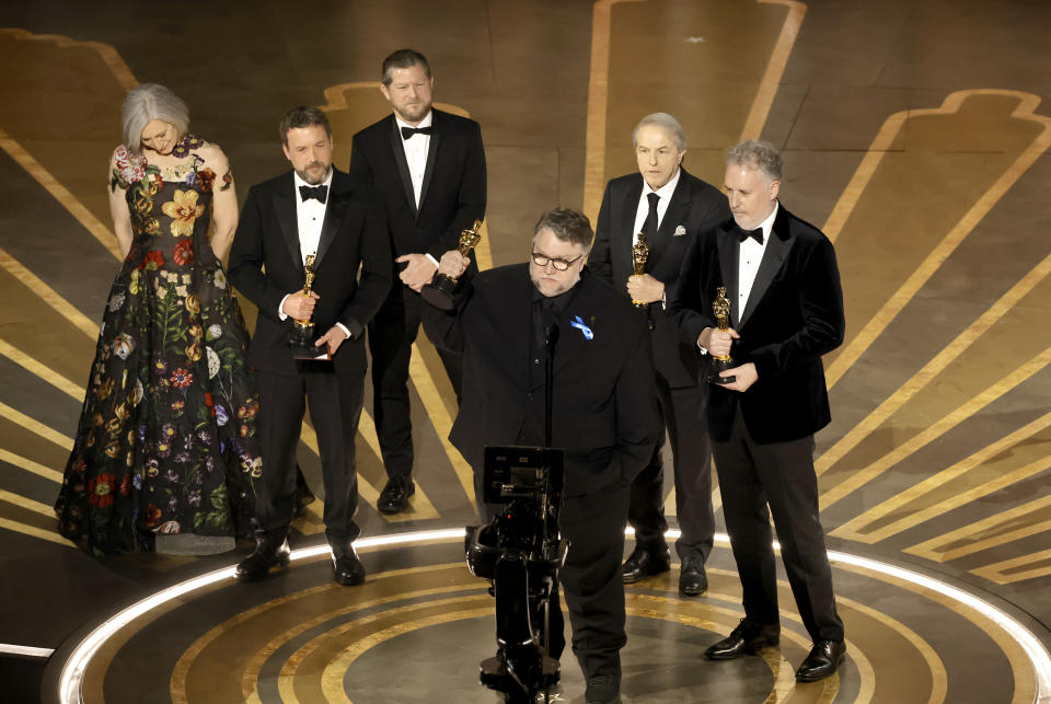 From left: Lisa Henson, Alexander Bulkley, Corey Campodonico, Guillermo del Toro, Gary Unger, and Mark Gustafson accept the Best Animated Feature Film award for “Guillermo del Toro’s Pinocchio’