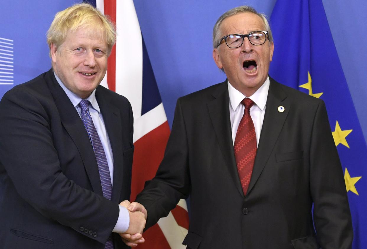 UK prime minister Boris Johnson and European Commission president Jean-Claude Juncker shake hands on the deal in Brussels on Thursday. Photo: Didier Lebrun/©Photo News via Getty 