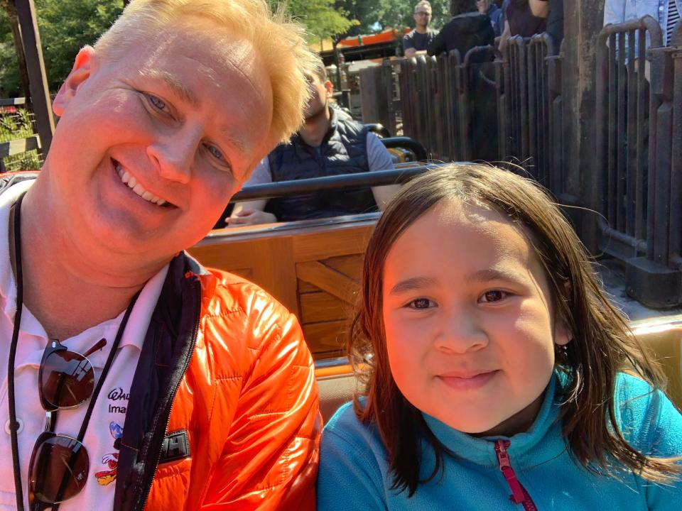 Robert Huebner poses for a picture with his daughter, Sora.