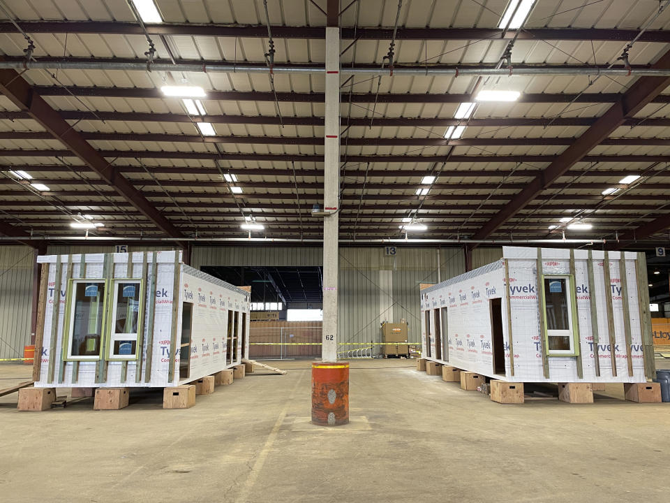 FILE - Mass timber affordable home prototypes are shown at the Port of Portland in Portland, Ore. on Jan. 27, 2023. Oregon lawmakers are expected to approve $200 million in spending to tackle the state's homelessness and housing crises. The package will be voted on by the state Senate on Tuesday, March 21, 2023, after passing the House with bipartisan support. (AP Photo/Claire Rush, File)