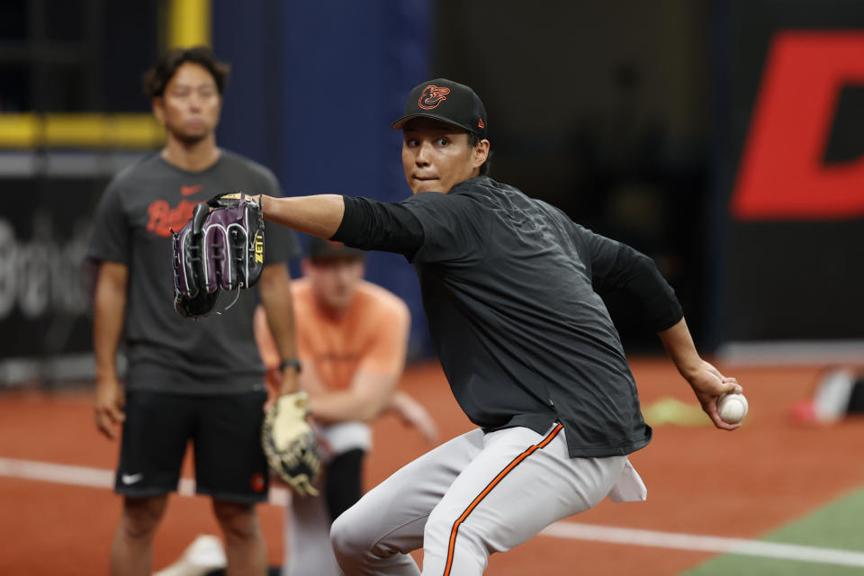 Baltimore Orioles relief pitcher Shintaro Fujinami throws in the bullpen during batting practice before playing against the Tampa Bay Rays in a baseball game Friday, July 21, 2023, in St. Petersburg, Fla. (AP Photo/Scott Audette)