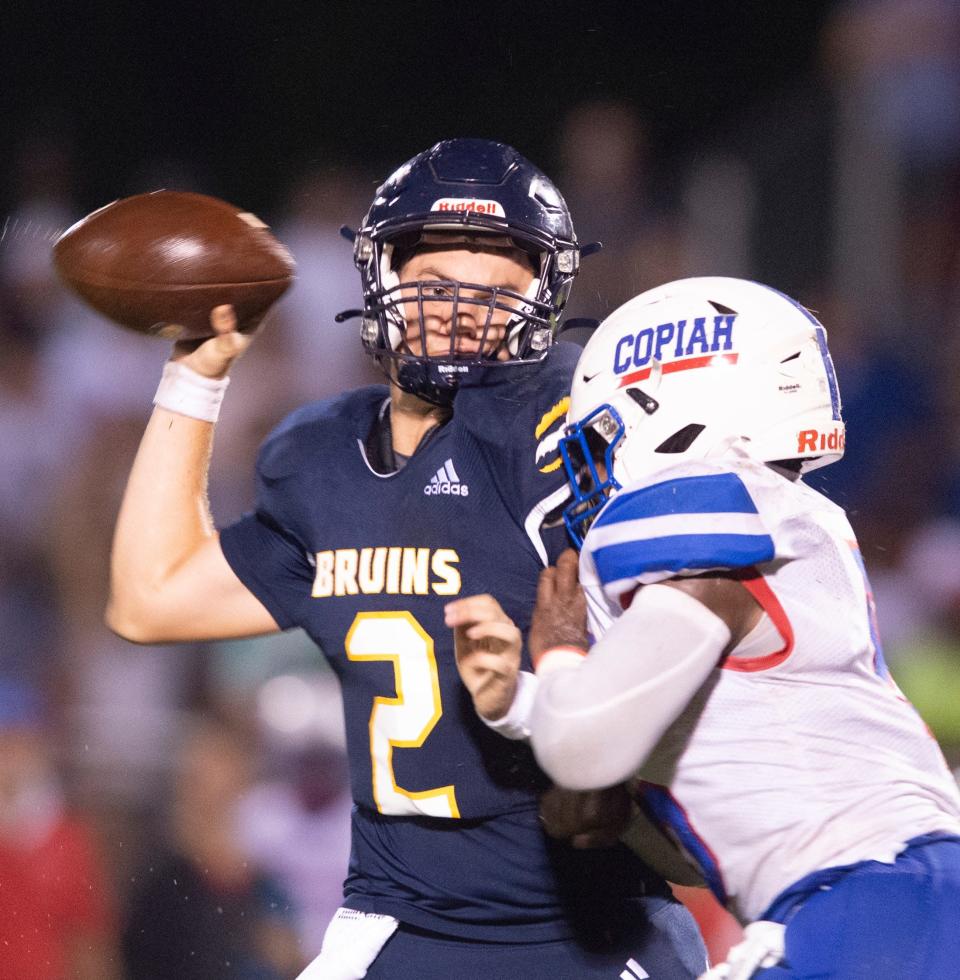 St. Joe QB Emille Picarella tries to find his receiver before getting tackled by Copiah Academyin Madison, Miss., Friday, Aug. 19, 2022.