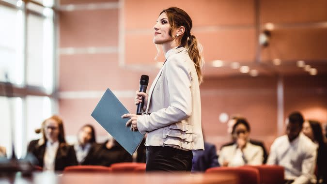 Business People Listening to the Speaker at a Conference.