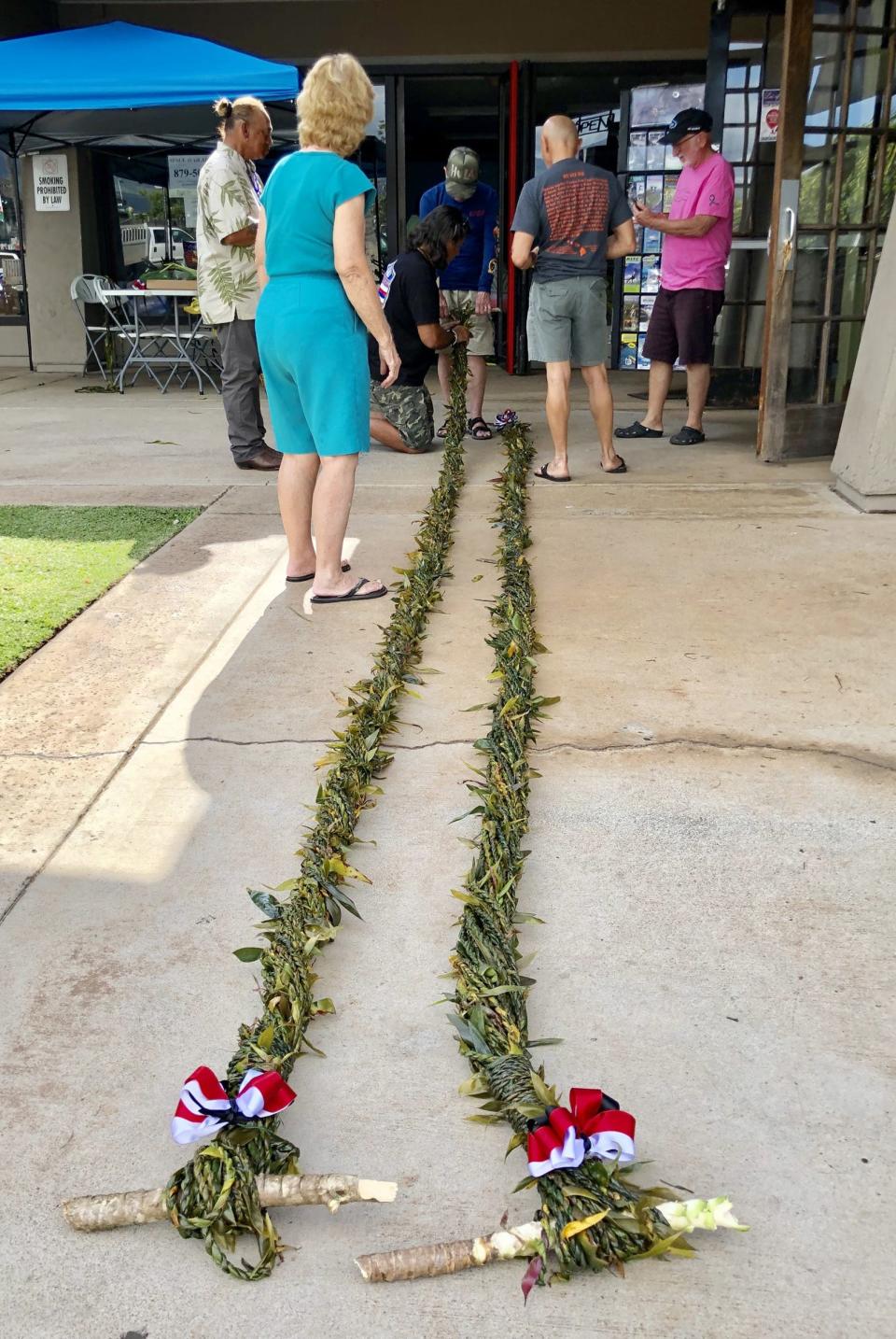 Artisans in Kihei, Hawaii, craft what will become a mile-long ti leaf lei, a symbol of aloha spirit traditionally shipped to the site of a natural or man-made calamity. It’s a frequent effort; this project was completed in about a week in 2019, four years before nearby Lahaina suffered a catastrophe of its own.