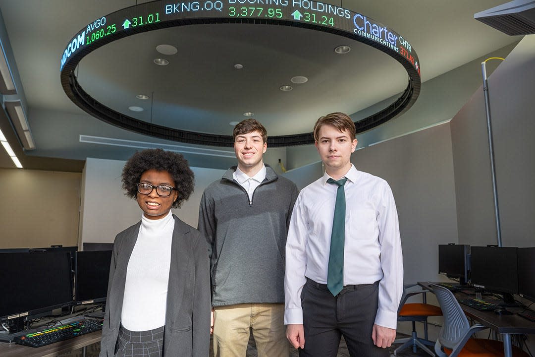 (left to right) Alexandria Walker, Evan Macko, and Carter Ptak made up an interdisciplinary team of RIT students who finished No. 1 in North America and third globally in the Bloomberg 2023 Global Trading Challenge.