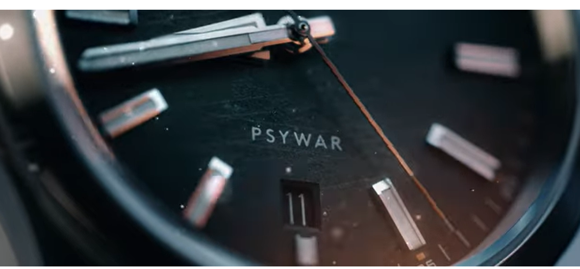 A watch with an acronym for psychological warfare is seen in the 4th Psychological Operation Group's new "Ghosts in the Machine 2," video.