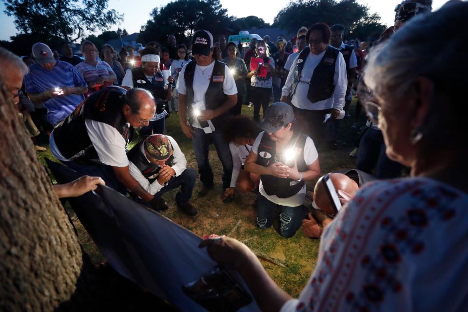 People visited Charles A. Guy Park to pay their respects for the students and teachers killed Friday, May 27, 2021. (Mark Rogers/For A-J Media)
