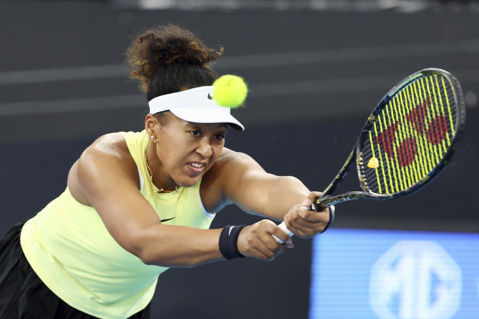 FILE - Naomi Osaka of Japan plays a shot in her match against Karolina Pliskova of the Czech Republic during the Brisbane International tennis tournament in Brisbane, Australia, on Jan. 3, 2024. The first 15-day Australian Open sets to start Sunday morning, Jan. 14, 2024. (AP Photo/Tertius Pickard, File)