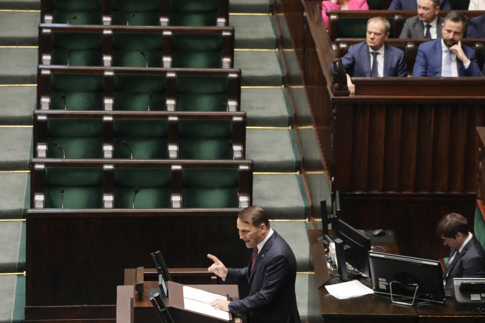 Poland's Foreign Minister Radek Sikorski delivers a speech to the parliament in Warsaw, Poland, on Thursday April 25, 2024. Sikorski told the parliament that the government wants to return to the group of countries which sets the agenda of the European Union, laying out the government's vision at a historically crucial moment with war across the border in Ukraine. (AP Photo/Czarek Sokolowski)