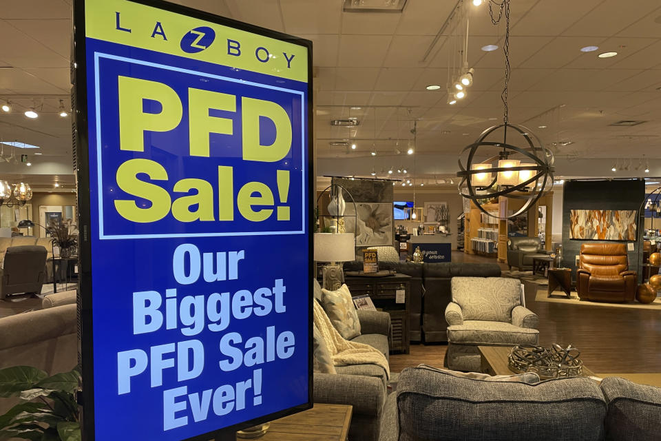 A furniture store in Anchorage, Alaska, advertises PFD sales Oct. 2, 2023, as the state plans to begin distributing $1,312 checks to nearly every Alaskan this week. The PFD, or the Permanent Fund dividend, is the annual share of the earnings from the state's nest-egg oil-wealth fund given to residents. Some use the money for extras like tropical vacations but others -- particularly in high-cost rural Alaska where jobs and housing are limited – rely on it for such things as home heating fuel and the snow machines that are critical for transportation. (AP Photo/Mark Thiessen)