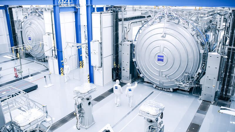 Workers at Carl Zeiss ZMT are seen outside giant vacuum chambers where optical systems for ASML’s new High NA EUV tool are tested, in Oberkochen