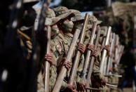 Bolivian soldiers prepare to destroy illegal coca plants during an eradication program, in Los Yungas