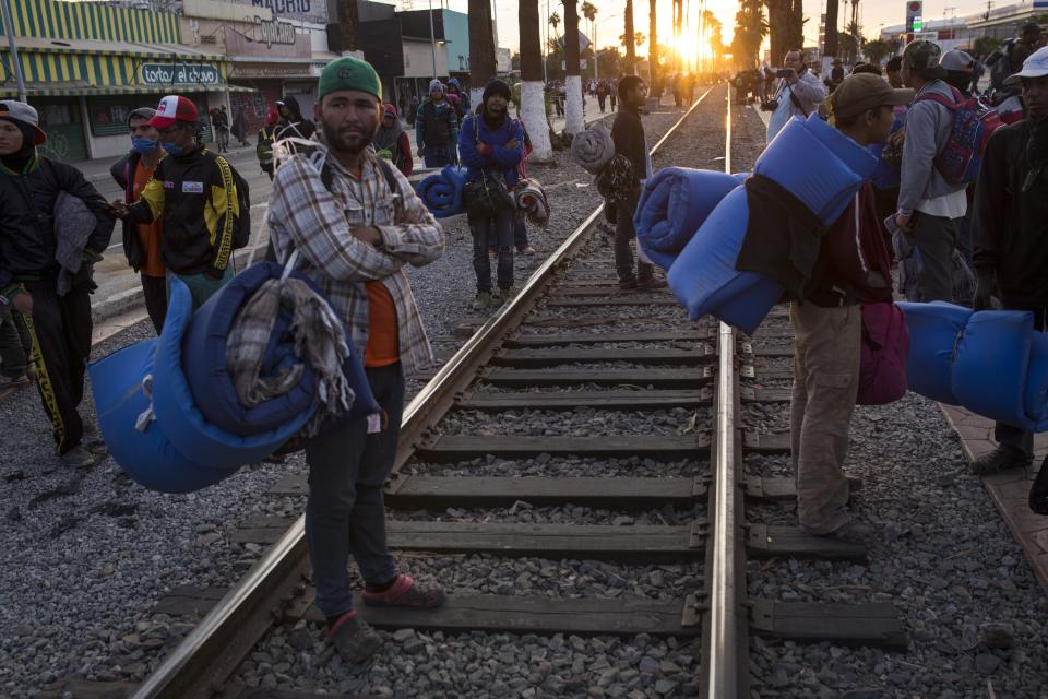 Central American migrants, part of the Central American caravan trying to reach the United States, continue their their journey as they prepare to leave Mexicali, Mexico, Tuesday, Nov. 20, 2018. Tensions have built as nearly 3,000 migrants from the caravan poured into Tijuana in recent days after more than a month on the road, and with many more months likely ahead of them while they seek asylum in the U.S. (AP Photo/Rodrigo Abd)