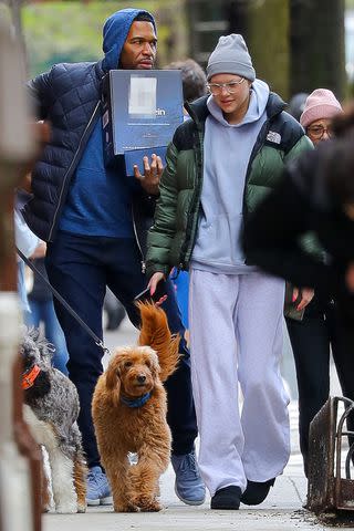 <p>The US Sun /MEGA </p> Michael Strahan and daughter Isabella Strahan with dogs