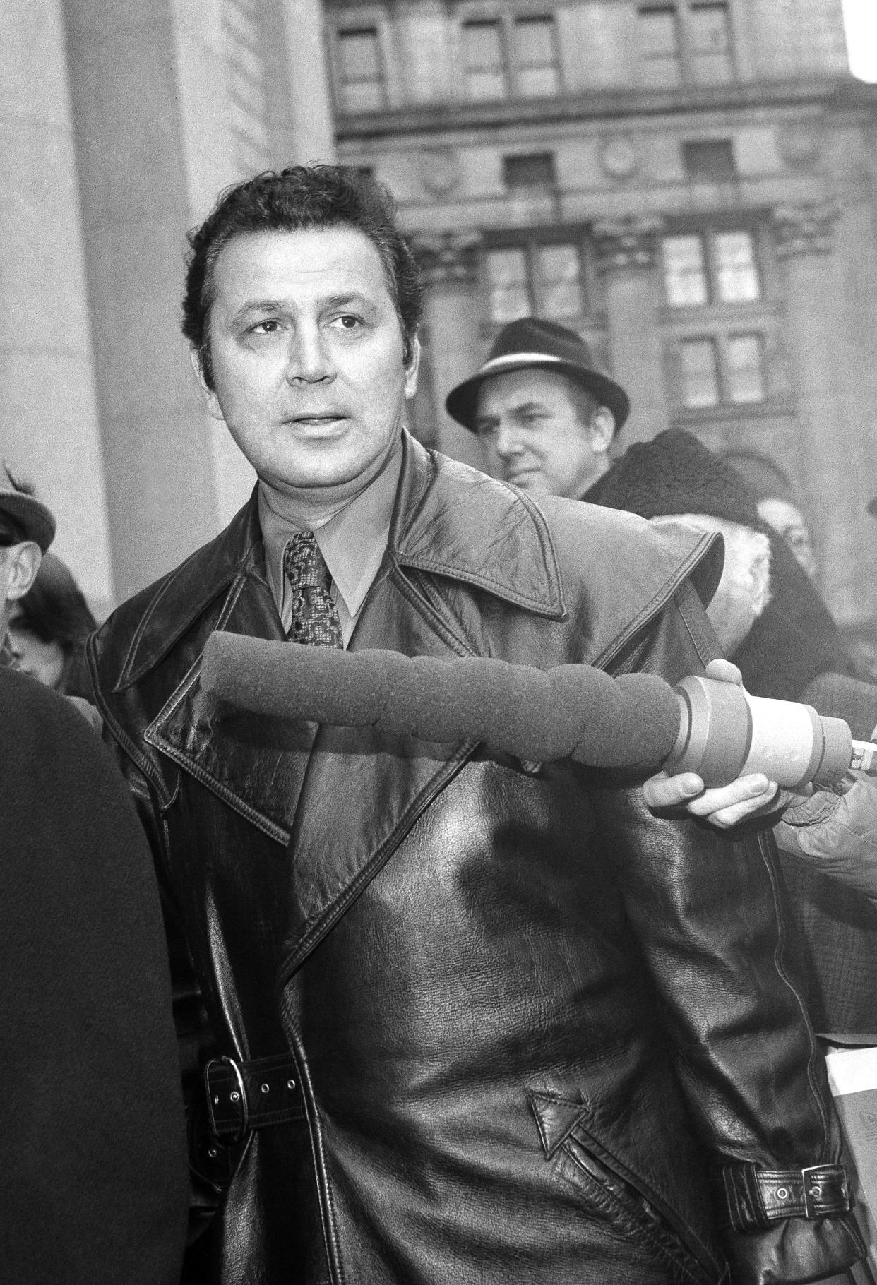 Photographer Ron Galella arrives at U.S. District Court in New York, Feb. 16, 1972. Galella was suing Jacqueline Onassis, charging that she interfered with his livelihood. 