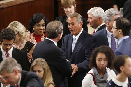 U.S. House Speaker John Boehner (R-OH) (C) gathers with fellow members of Congress to elect the speaker on the first day of their new session at the U.S. Capitol in Washington January 6, 2015. REUTERS/Jonathan Ernst